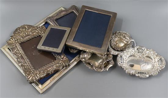 Five silver mounted photograph frames, four pierced silver nut dishes and a pair of plated nut dishes.